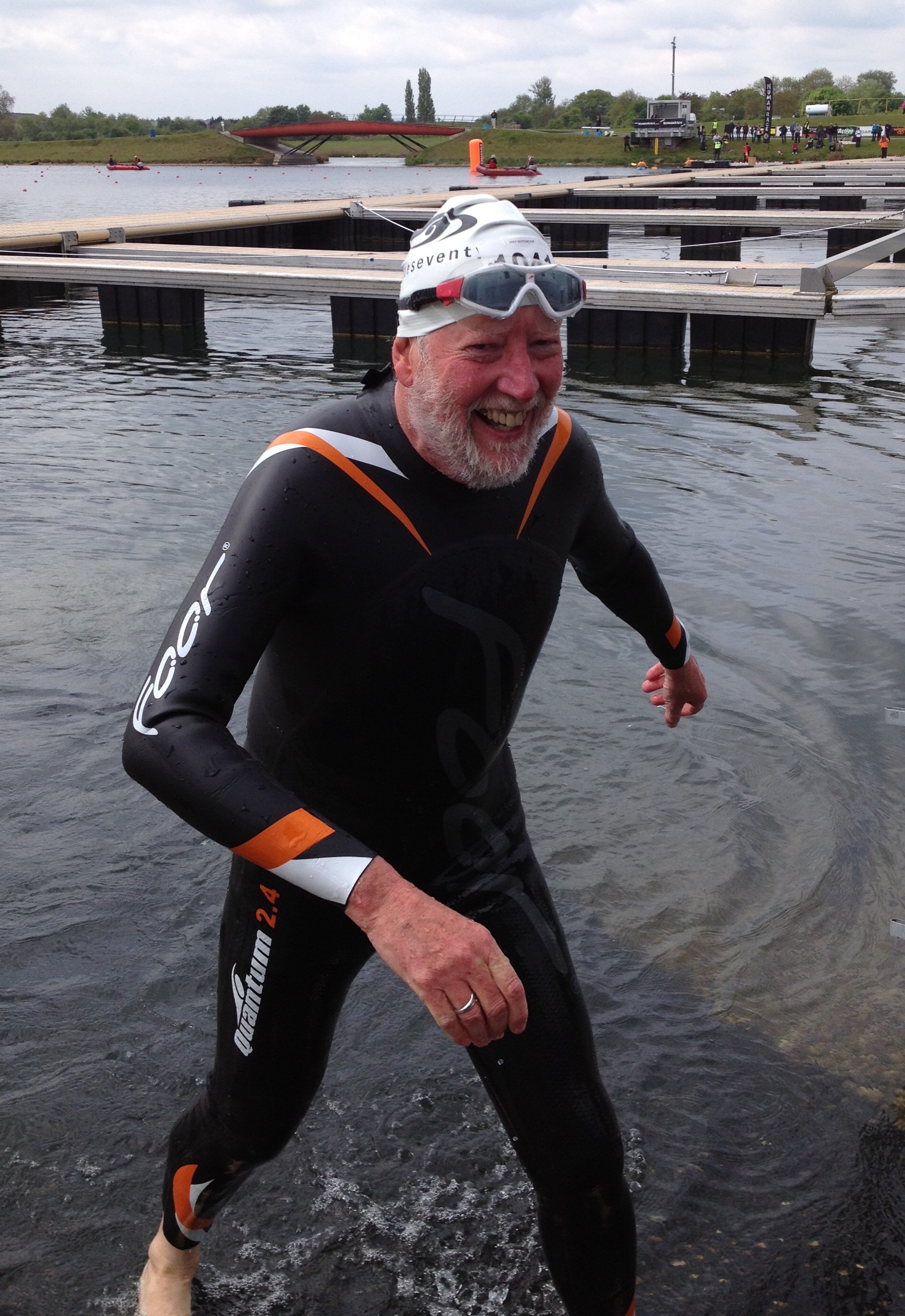 64 and doing first triathlon coming out of the swim smiling